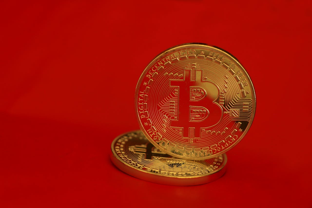 Two bitcoins on red background